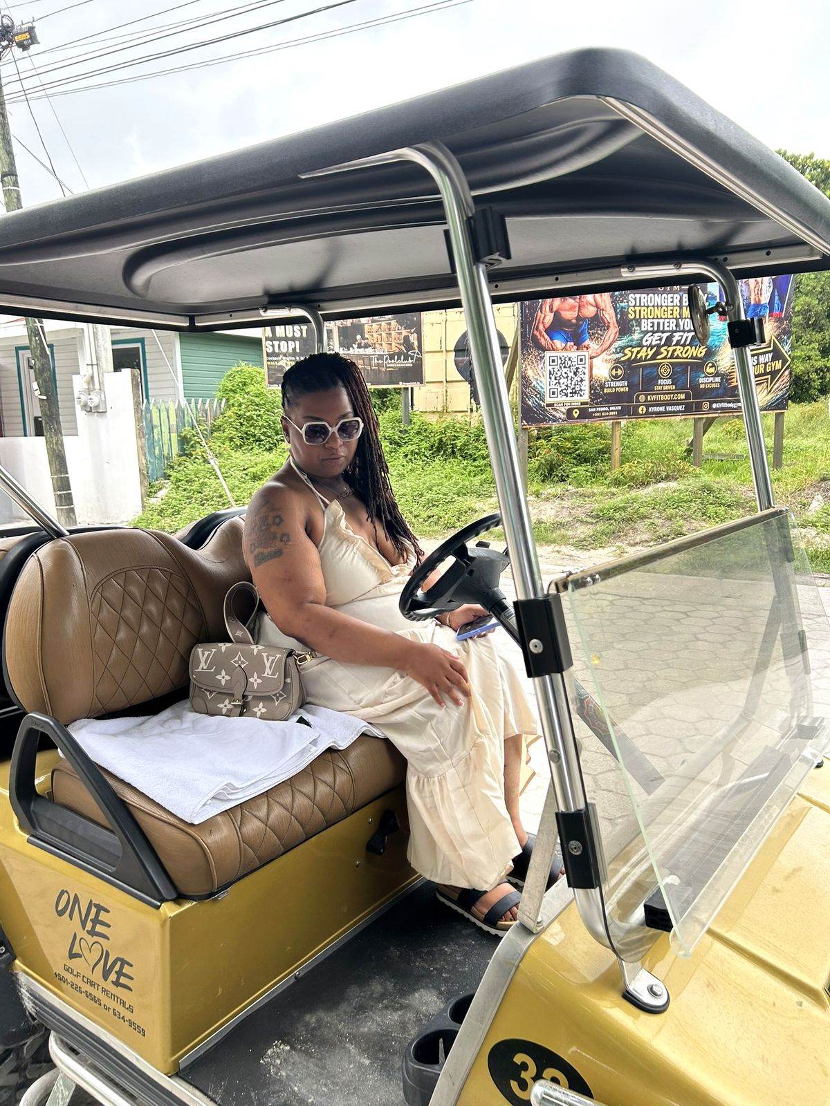 Golf cart parked on a street in San Pedro, Ambergris Caye